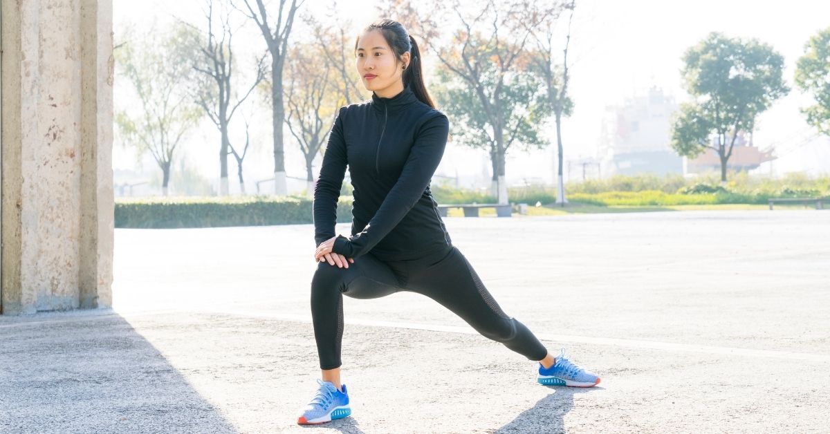 woman stretching in autumn