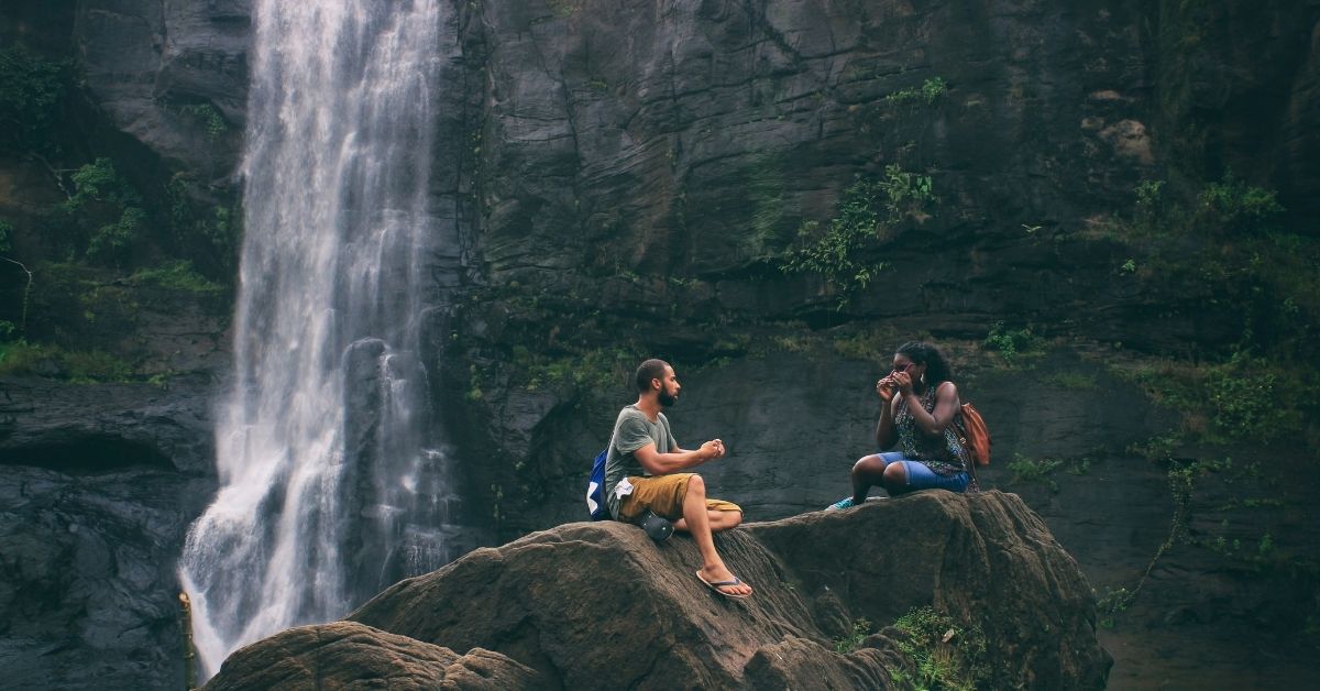 two people travelling waterfall